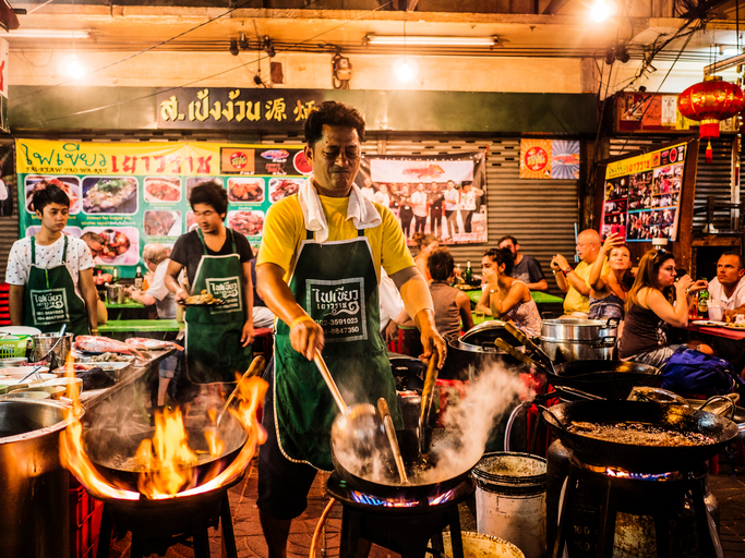 Cooking food in the street Chinatown Bangkok Thailand