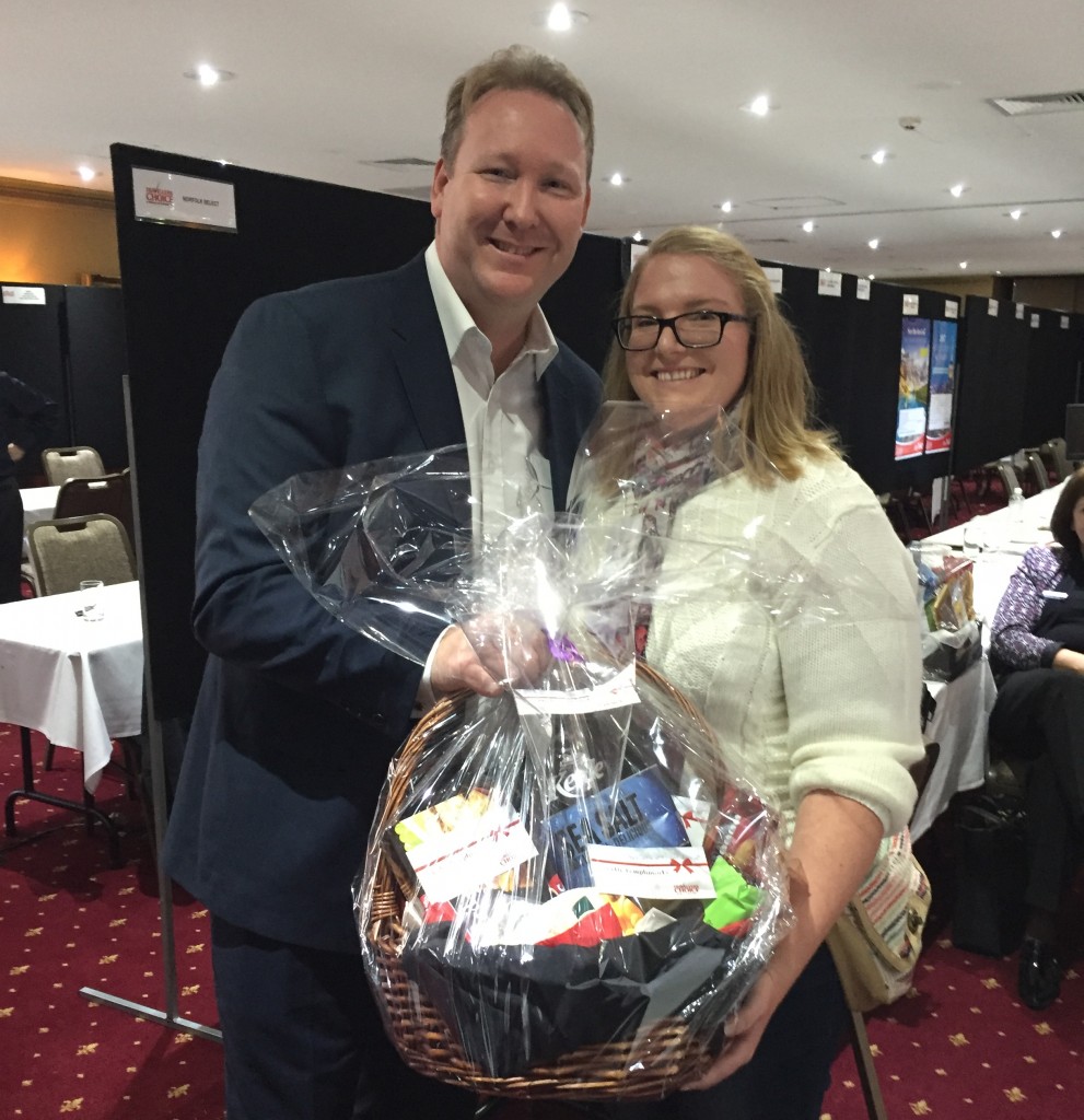 TC1_Christian Hunter presents Beth Paton with gift basket_QLD Frontliners 2016