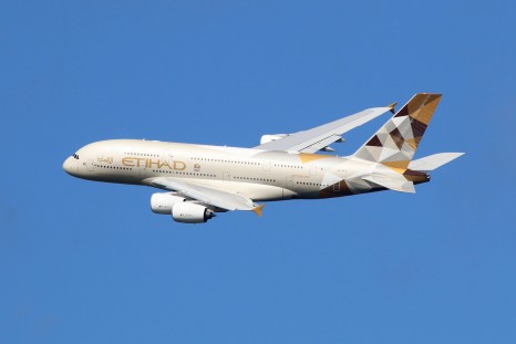 London Heathrow, United Kingdom - August 28, 2015: An Etihad Airways Airbus A380 with the registration A6-APC taking off from London Heathrow Airport (LHR) in the United Kingdom. The Airbus A380 is the world's largest passenger airliner. Etihad is the flag carrier airline of the United Arab Emirates based in Abu Dhabi.