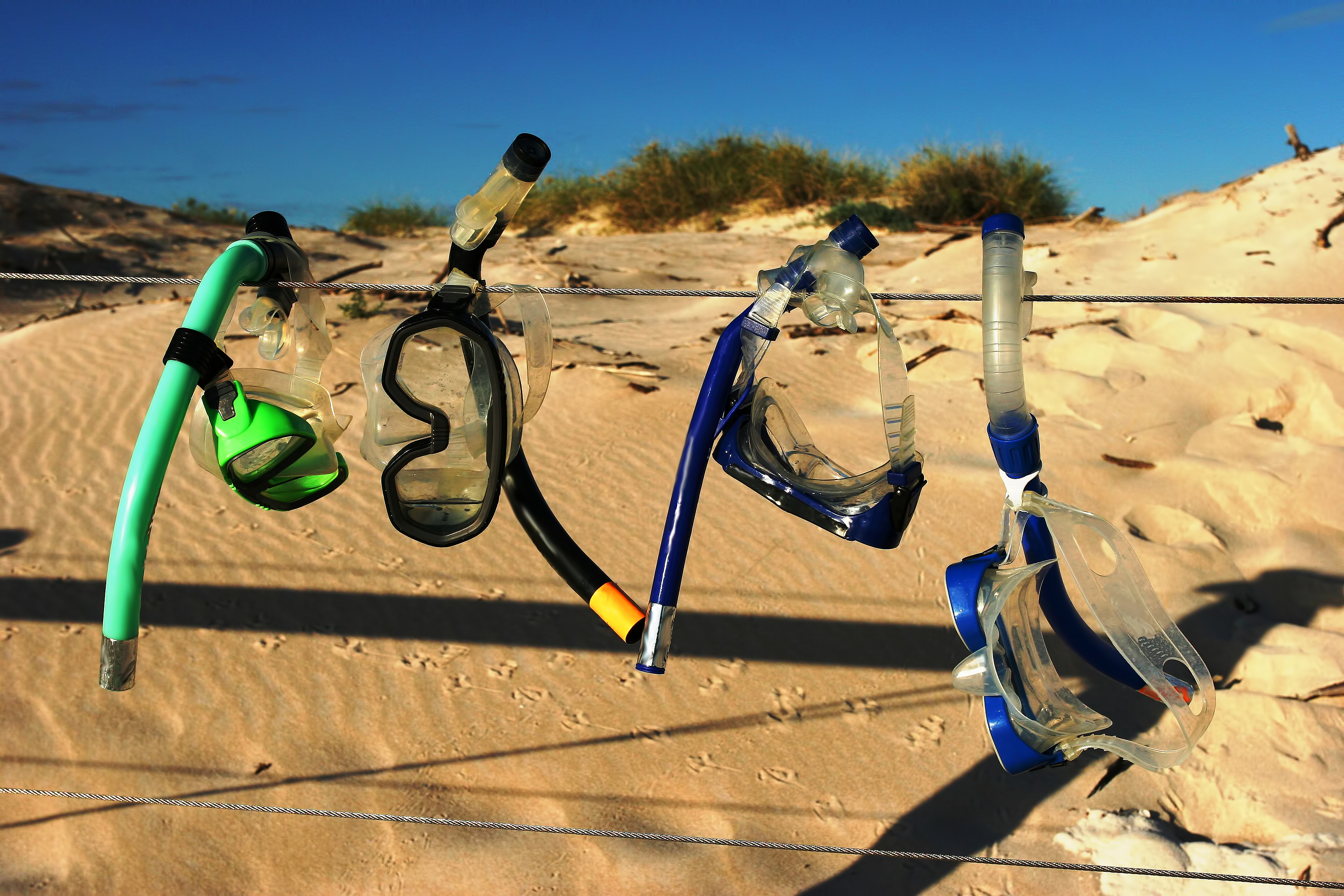 Snorkelling Gear Drying on a Wire Fence