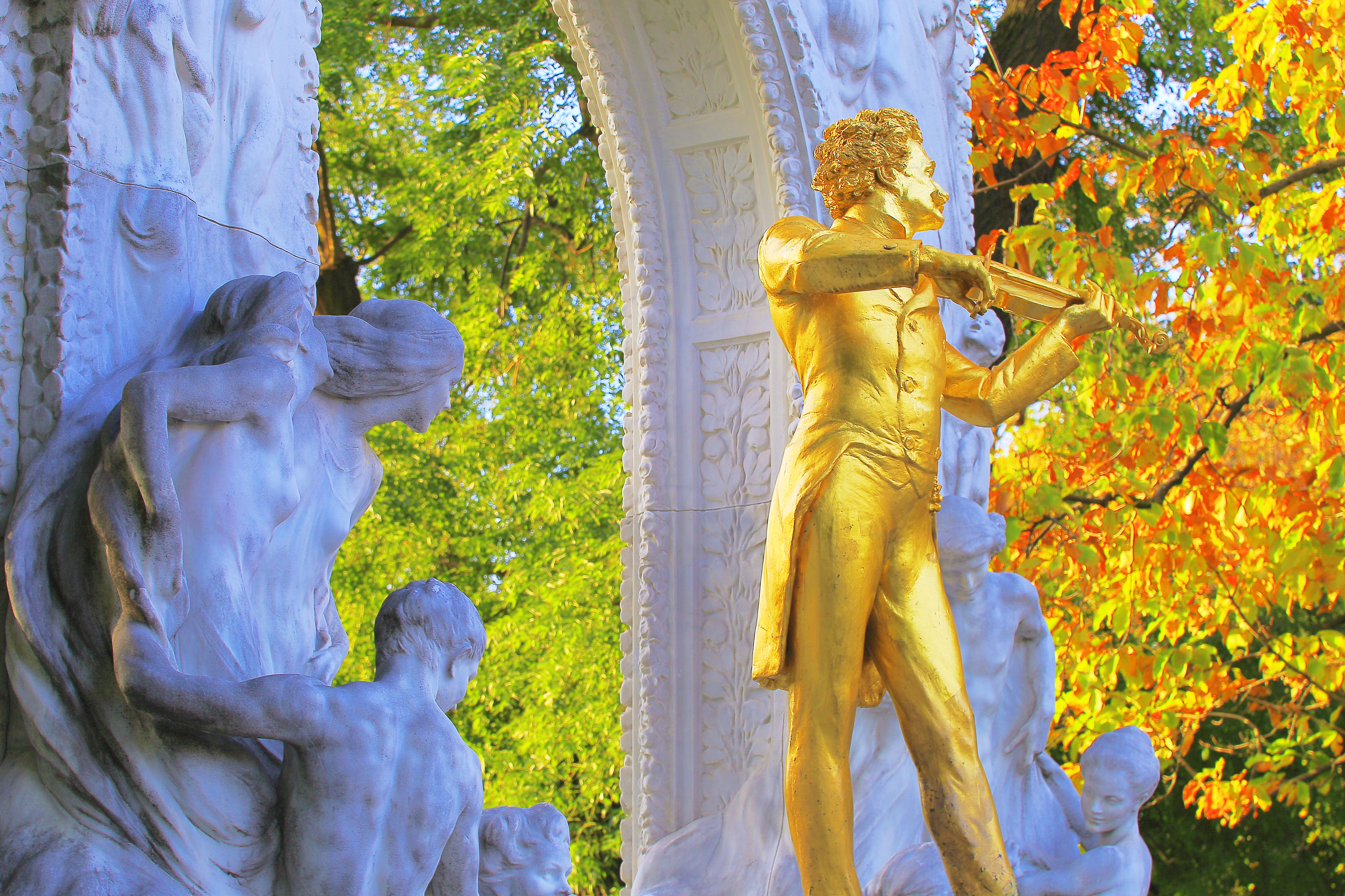 Monument of Austrian composer Strauss II, in Stadtpark at gold romantic autumn - City Park, Vienna, Austria