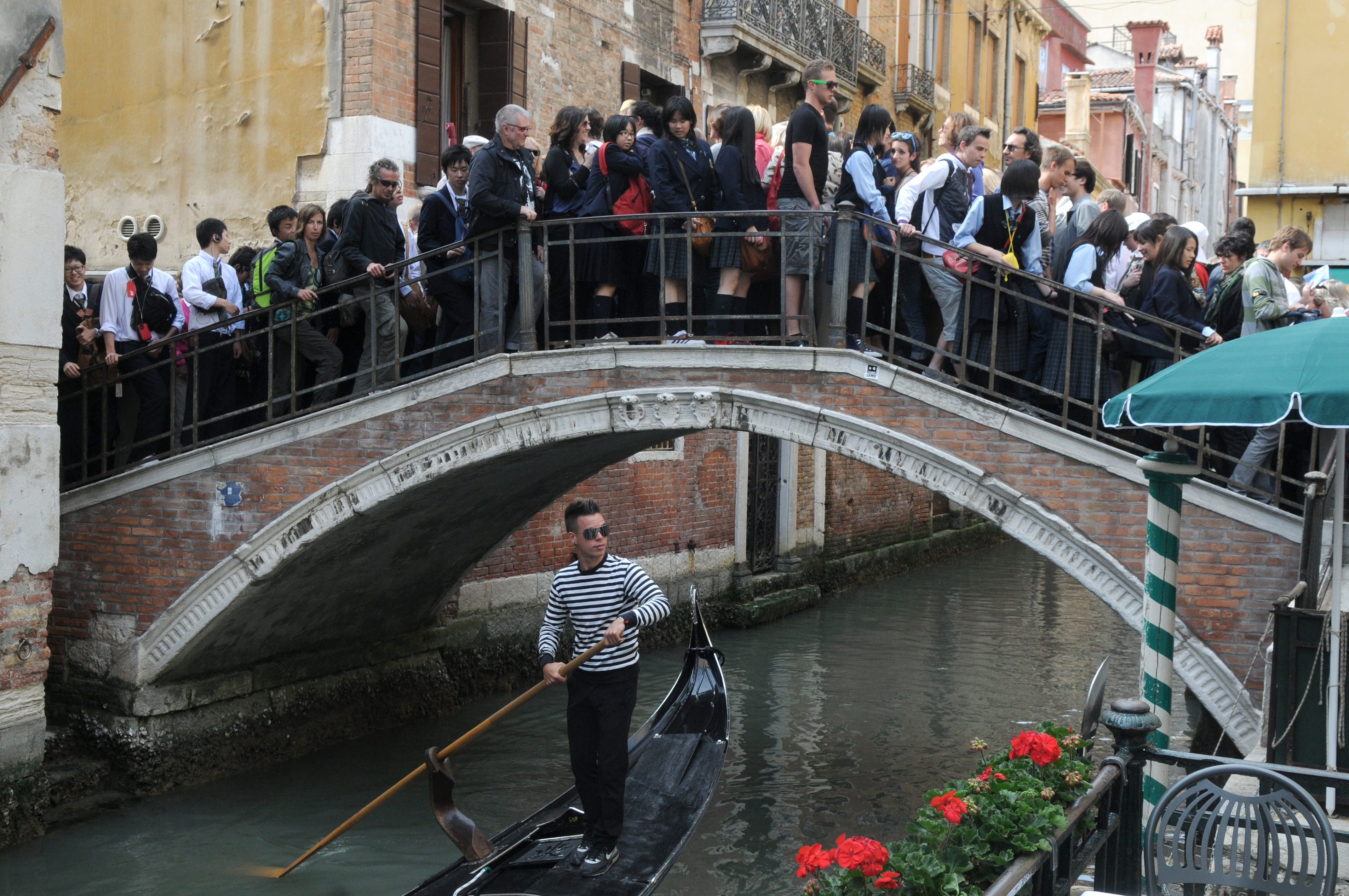 Tourists in the crowded the bridge in Venice.