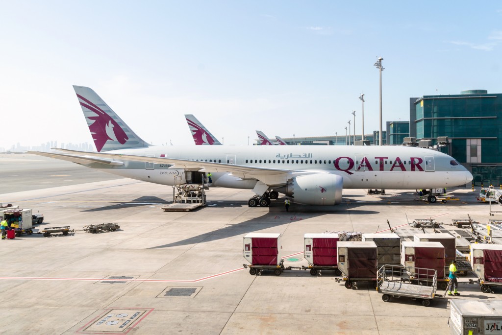 AirHelp's best airline in the world Qatar Airways and one of its planes at Hamad International Airport (another high achiever in the rankings).