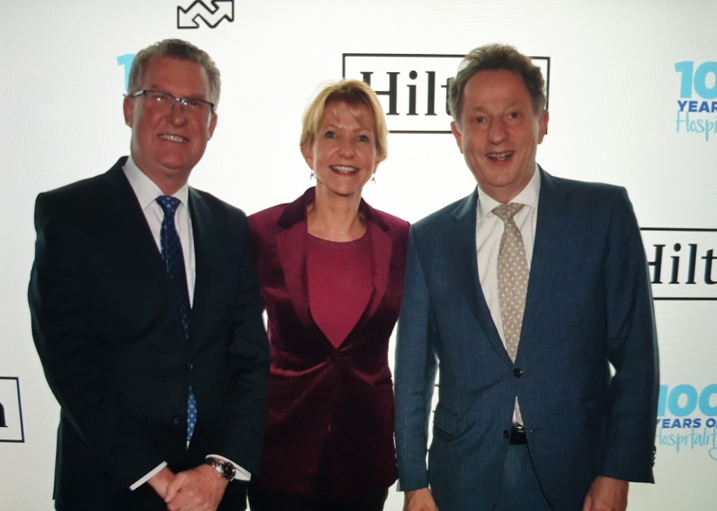 Michael Johnson (left), pictured at the event with Heidi Kunkel, Vice President of Operations – Hilton and Ronald van Weezel, GM of Hilton Sydney.