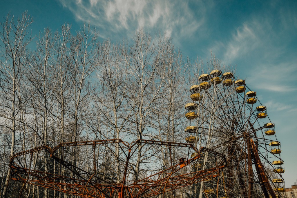 In Pripyat, once home to 50,000 people who mainly worked at the plant, an amusement park houses a rusting hulk of a merry-go-round and dodgem-car track, and a giant Ferris wheel that never went into operation.