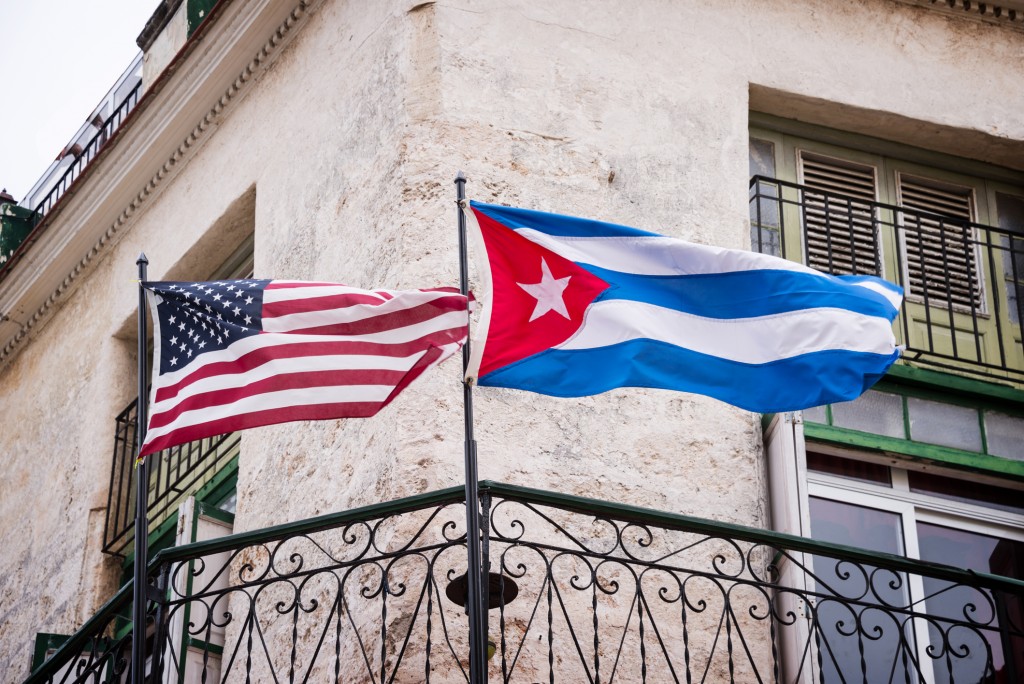 US and Cuban flags side by side in Havana, Cuba.