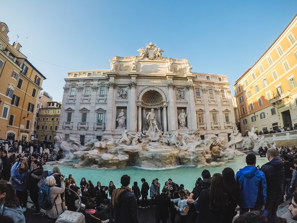 Many tourists around the Fontana Di Trevi fountain at the Piazza Di Trevi.