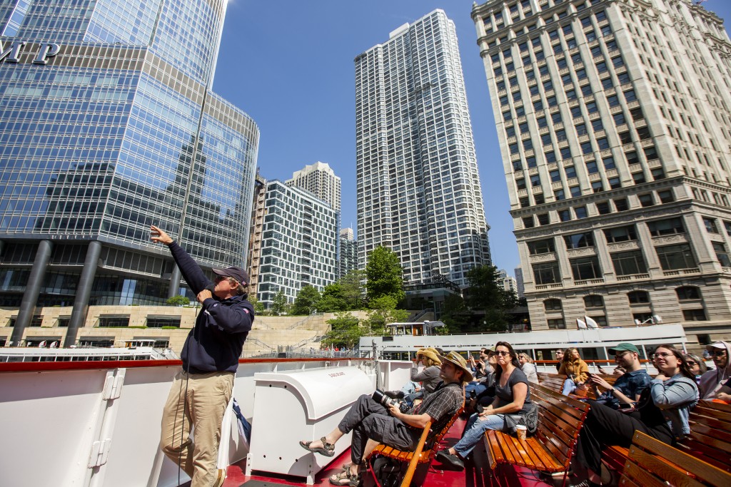 A multitude of architectural styles are seen from an open decked boat during the Chicago Architecture Boat Tour along the Chicago River in Chicago, Illinios.